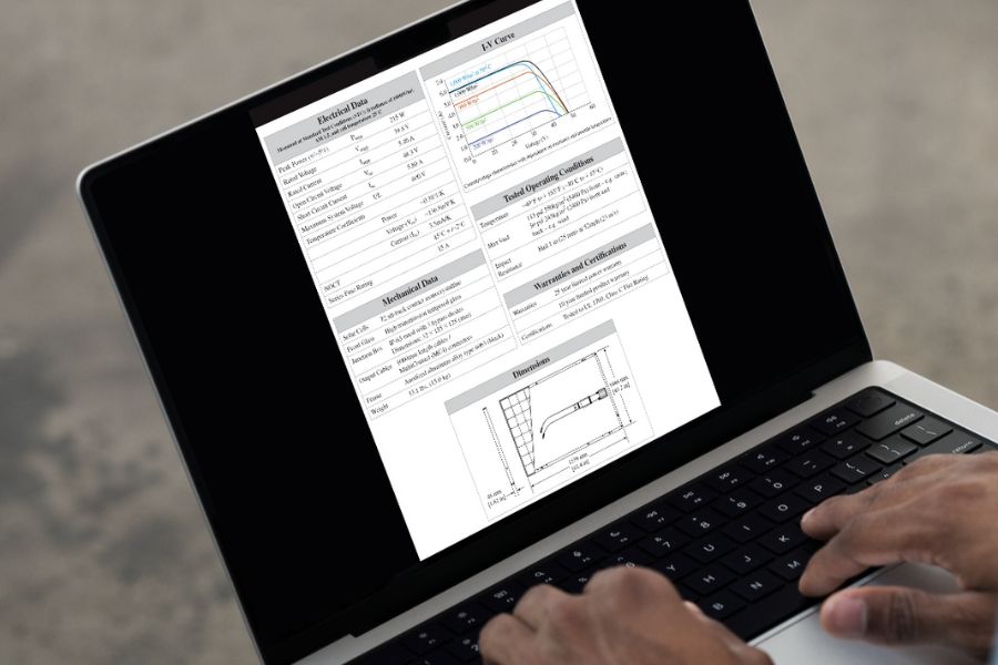 Reading solar panel data sheet on laptop